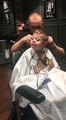 Toddler Happily Receives Haircut