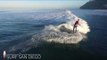 Scores of Surfers Majestically Catch Waves