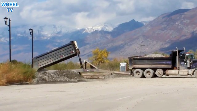 Double Dump Truck dumping gravel into piles