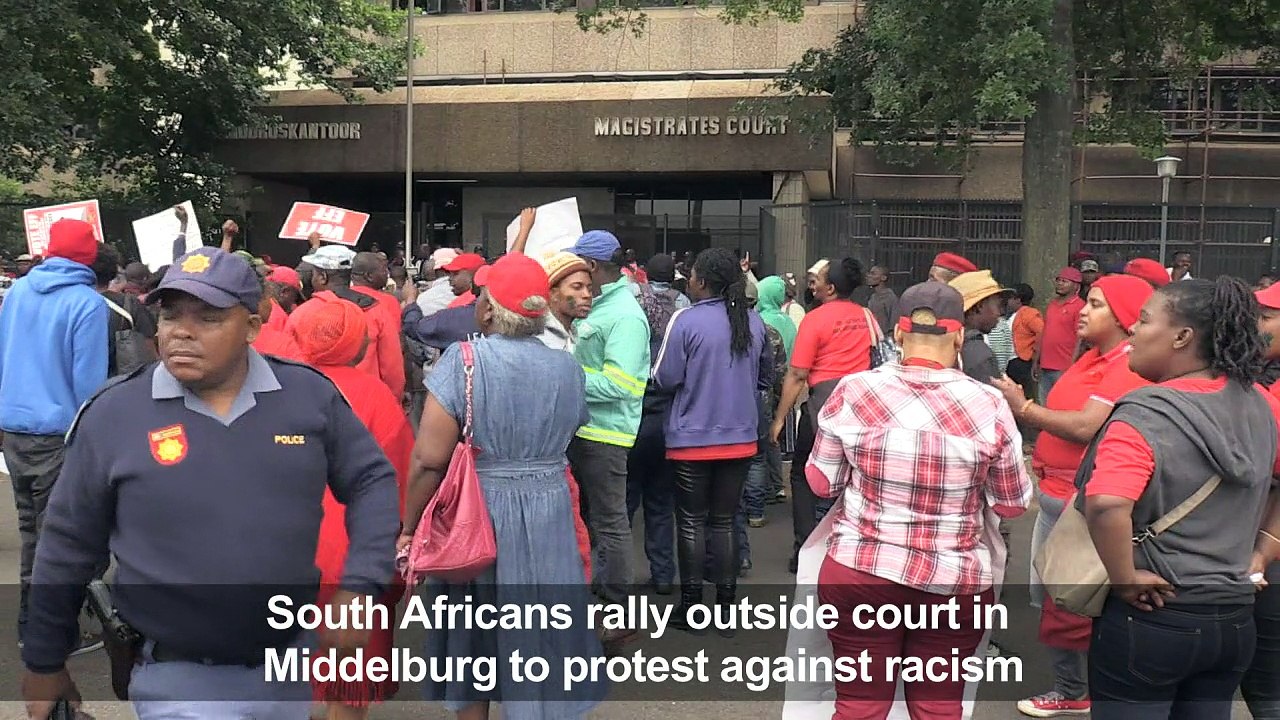 White men charged with shoving black South African into coffin