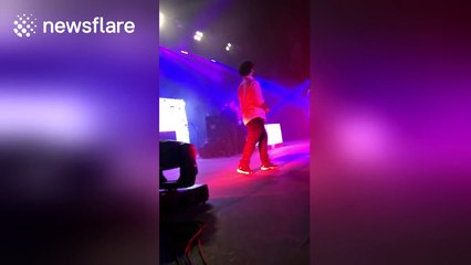 Travis Scott makes fan jump into crowd after inviting him on stage