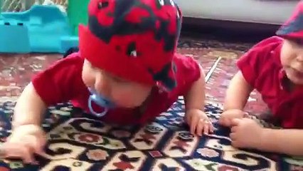 Two Baby Boys Take Turns Stealing a Pacifier and Crying