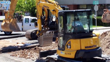 CAT Exavator and Komatsu PC 55 Mini Excavator moving dirt