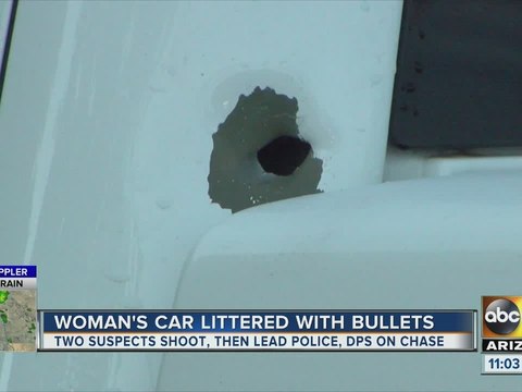 PD: Pursuit suspects shot at woman's vehicle in parking lot, along freeway