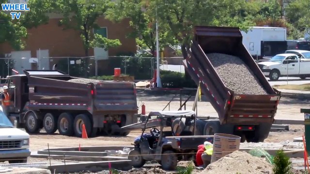 Double dump truck dumping a load of gravel