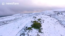 Amazing bird's-eye view of snow covered mountain in Northern Ireland