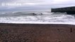 Surfers ride waves off Brighton coast during Storm Angus