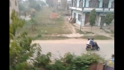 Two Men On A Bike Outrun A Charging Rhinocerous