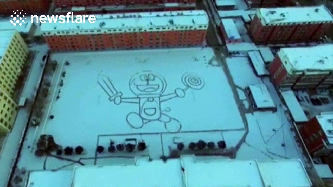 Art teacher creates massive Manga character out of snow in school playground