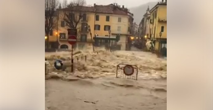 River Swells Dangerously Over Bridge in North Italian Town of Garessio