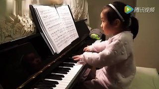 Three Years Old Girl Playing Piano.