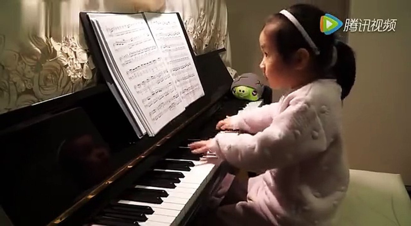 Three Years Old Girl Playing Piano.