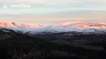 Beautiful sunrise over snow-covered mountains in Scotland