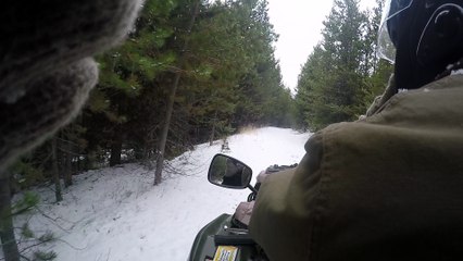 Riding the ATV in the snow to retrieve my trail cams