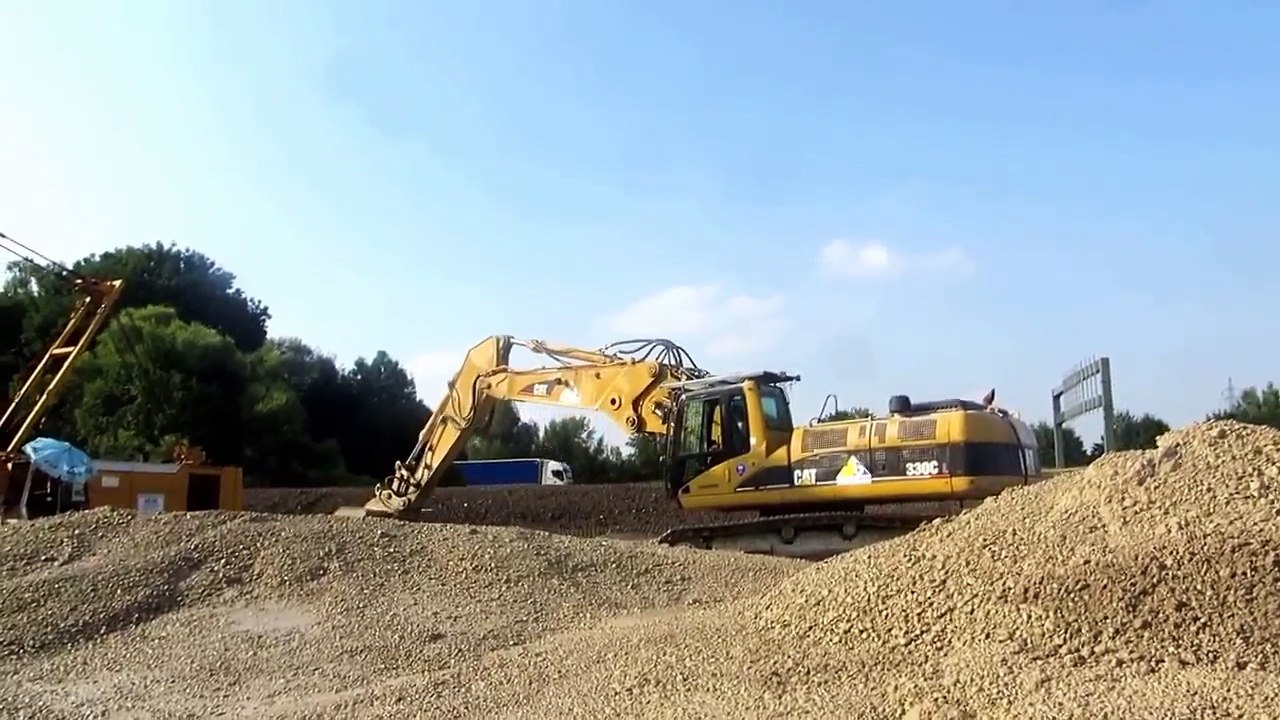 CAT 330C Excavator working at construction