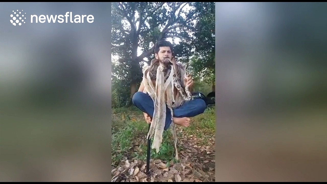 Brazilian activist performs bizarre levitation trick with snakes around his neck