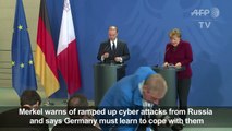 Merkel warns of ramped up Russia cyber attacks ahead of vote