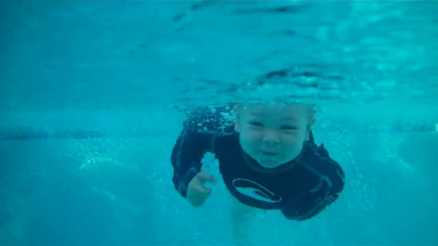 Unbelievable Baby Jumps in and Swims Across Pool