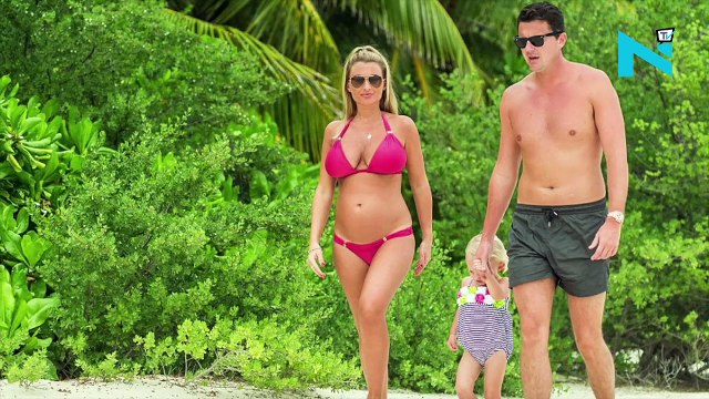 Billie Faiers flaunts her baby bump in pink bikini