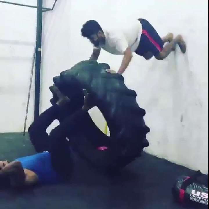 dynamic duo worked out together with a giant tire