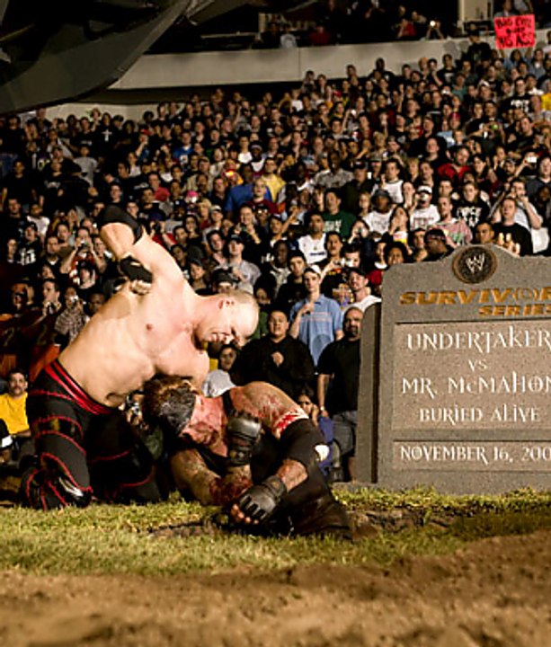 Kane buries The Undertaker alive 2003