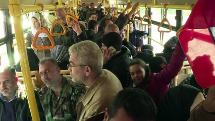 Buses take residents back to abandoned east Aleppo homes