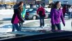 This dad is picking up his daughter from school and decides to film all the kids slipping on an ice path