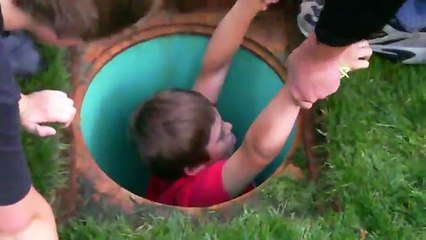 Kid gets stuck in water drain.