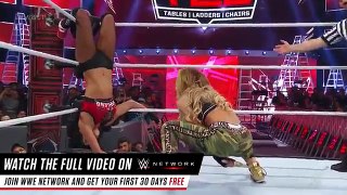 Carmella-uses-a-kendo-stick-to-batter-Nikki-Bella-WWE-TLC-2016 -