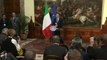 Italy's prime minister remains until budget approval