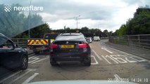 Dashcam catches BMW crash on roundabout