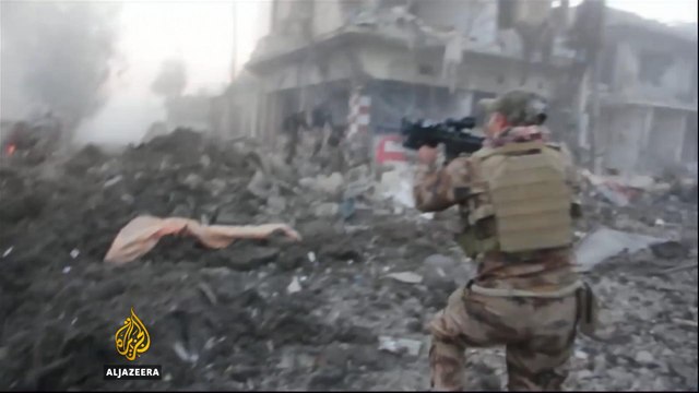 Iraqi army fights street to street in eastern Mosul