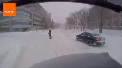 Snowboarder Towed Through Canadian Street