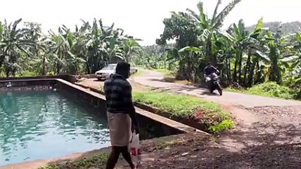 Funny bike  rider in village.