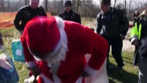 Parachuting Santa brings gifts to children in Amatrice