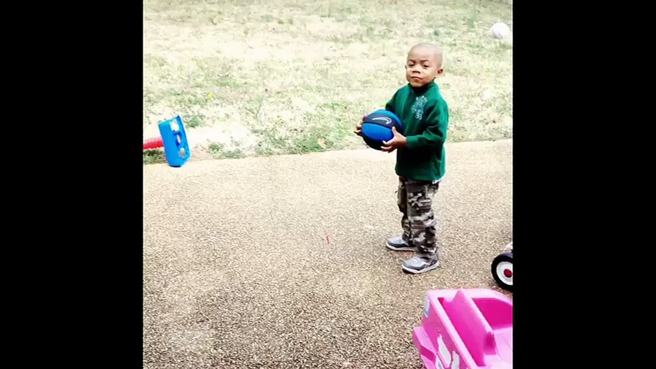 Little boy bewildered by cousin's slam dunk