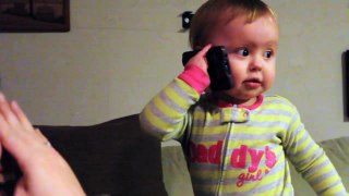 Baby Talks to Dad on Phone