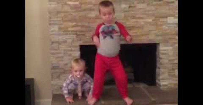 Toddler Face Plants Spectacularly While Dancing With Older Brother