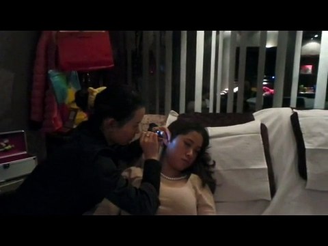 Chinese Ear Cleaning (1) A lady enjoying a relaxing ear cleaning session
