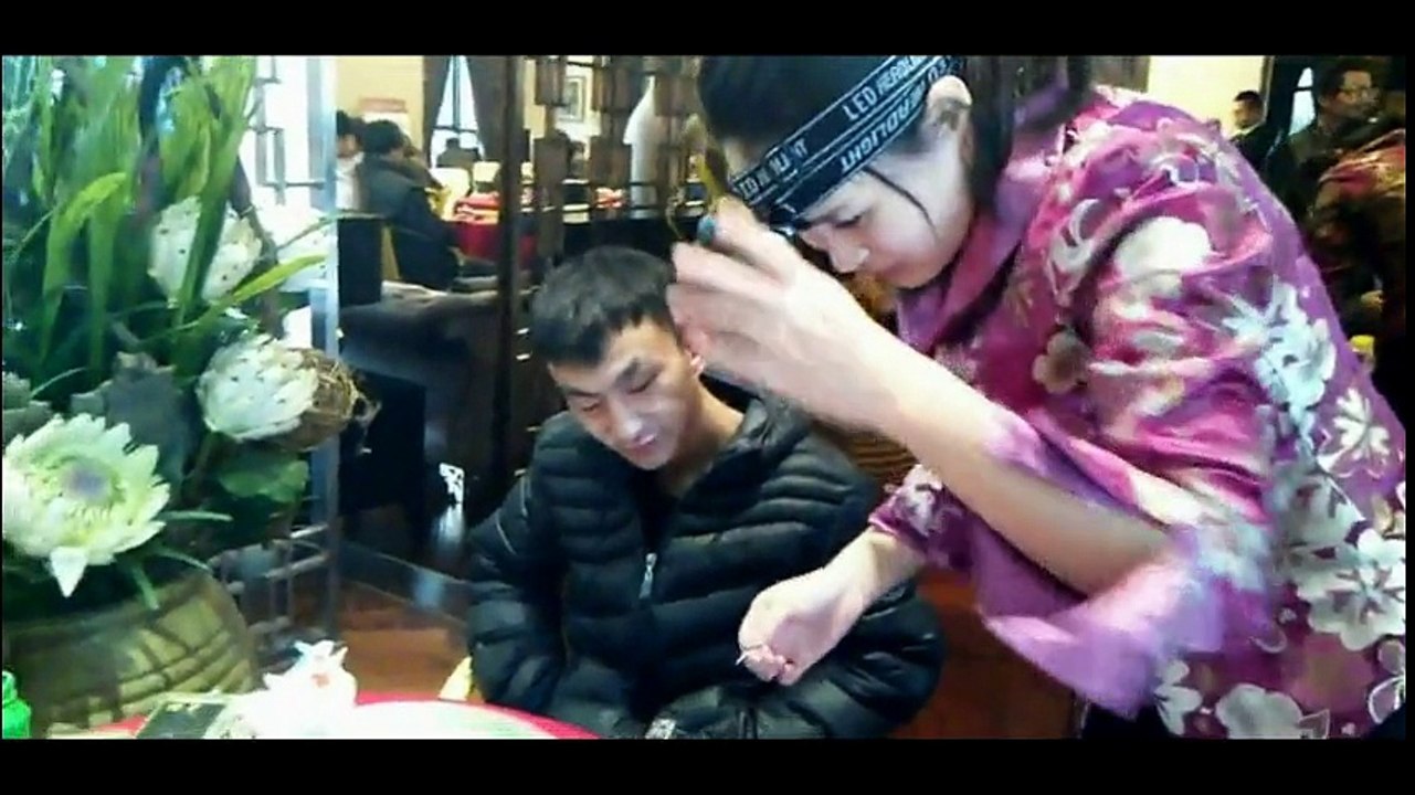 Chinese Ear Cleaning (4) A pretty lady cleaning the ears of a lucky man