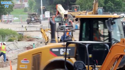 Deere 27C Mini Excavator working with arm then bulldozer attachment