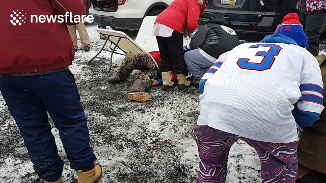 Buffalo Bills fan breaks leg jumping off car