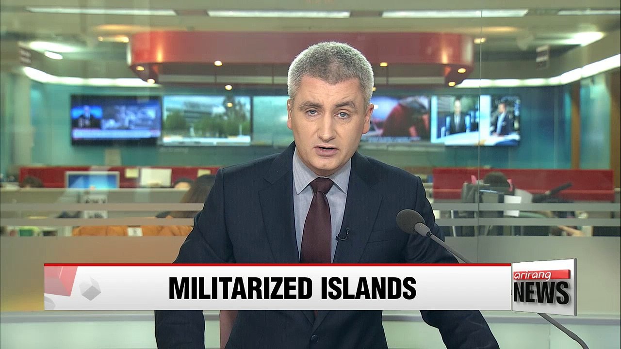 Satellite photos show China putting 'weapons' on South China Sea islands