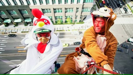 A monkey and a rooster clean windows in Tokyo