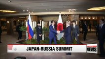 Putin, Abe vow cooperation over islands disputed since World War II