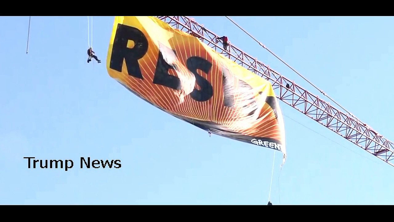 NEWS ALERT , Protesters on a crane near The White House release a sign that says _RESIST._