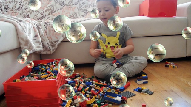 Kid plays with LEGO Blocks. Build a car. Build a boat. Learn colour with LEGO