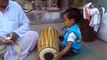 God gift - small kid playing dholak