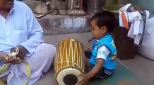 God gift - small kid playing dholak