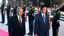 Japan and Russia sign trade deals but remain marooned over islands